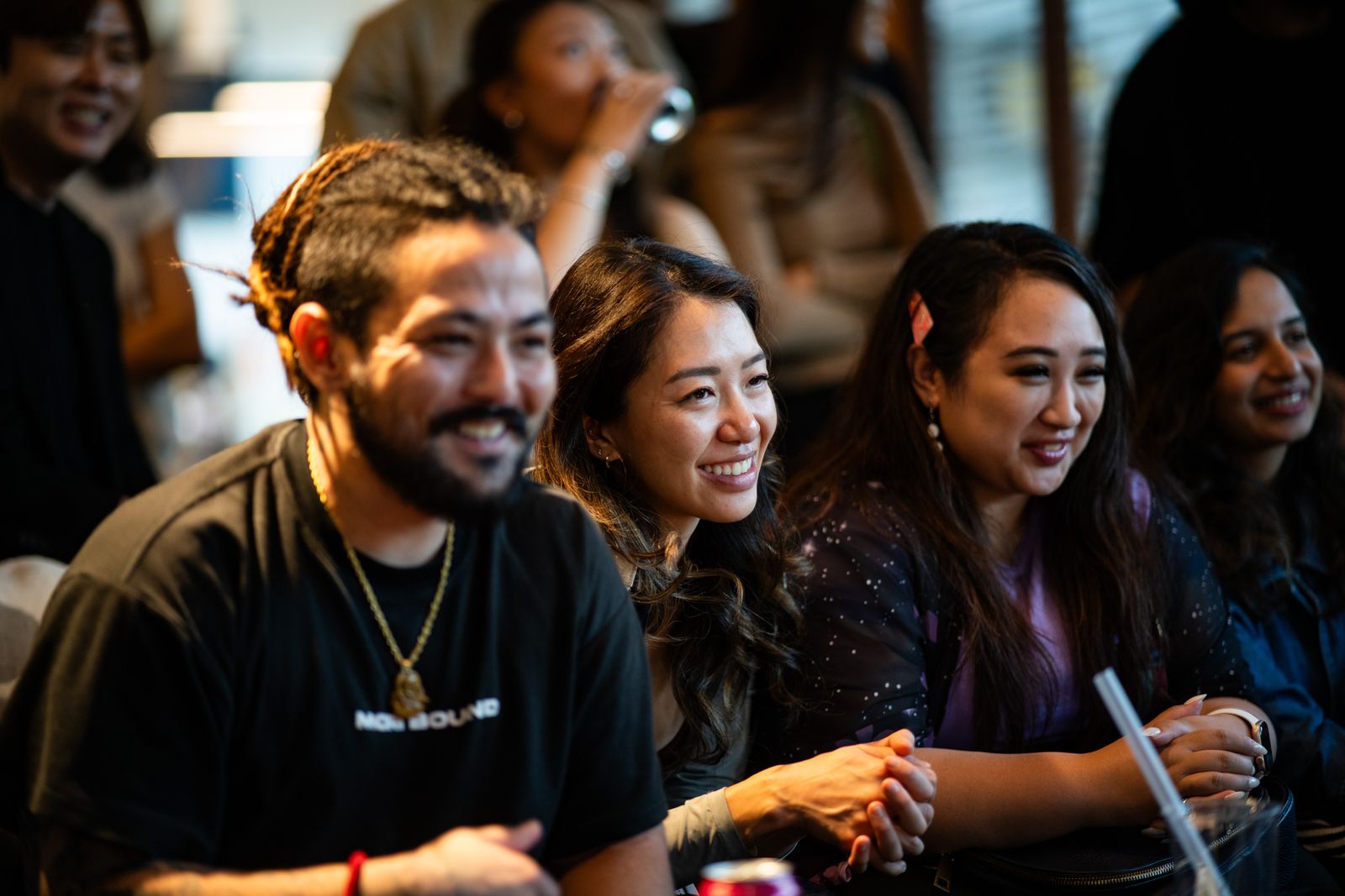 Guests smiling in the audience